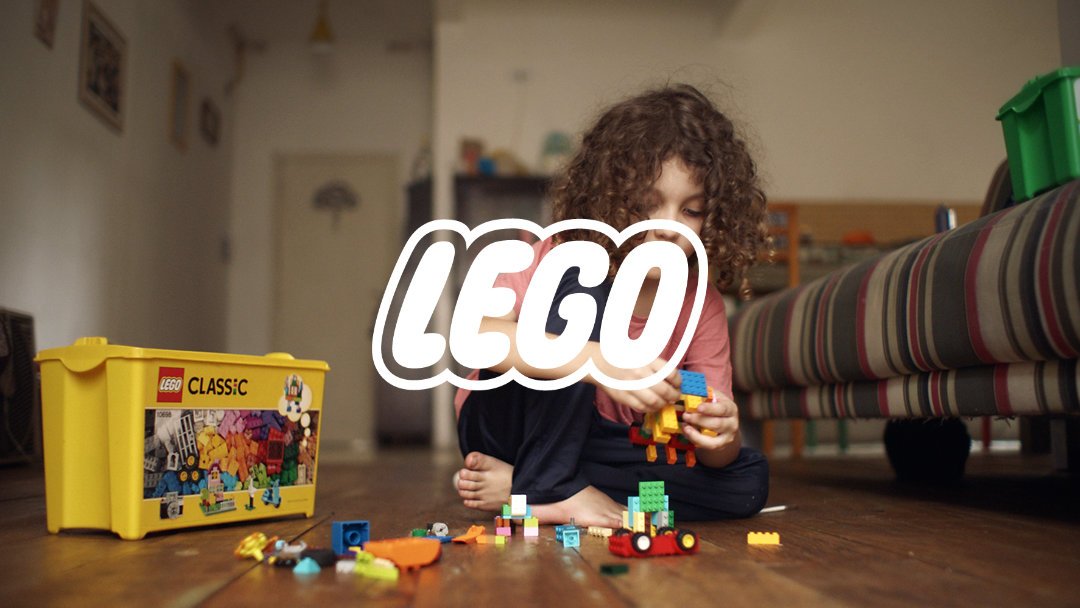 Child playing with LEGO on the floor